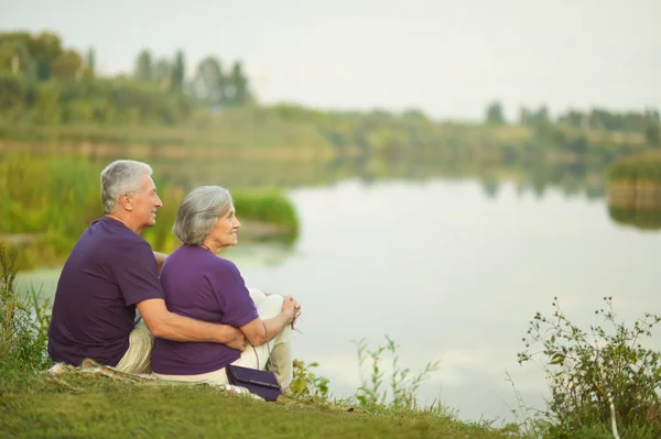 Elderly couple in nature — Stock Photo, Image