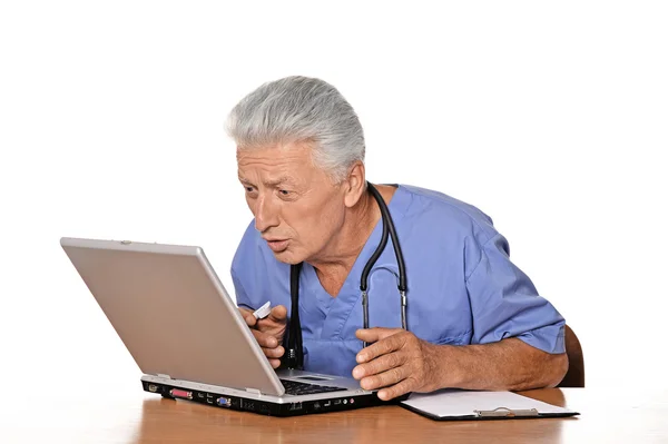 Elderly doctor with  laptop — Stock Photo, Image