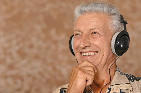 Senior man in headphones — Stock Photo, Image