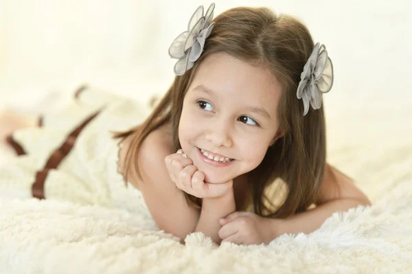 Happy young girl in bed — Stock Photo, Image