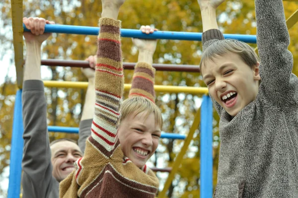 Family at horizontal bar — Stock Image Family at horizontal bar Stock Photo