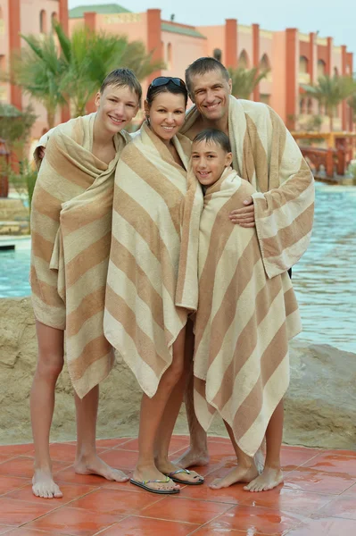 Happy family covered with towels — Stock Photo, Image