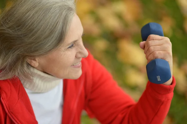 Senior woman exercising in park — Stock Photo, Image