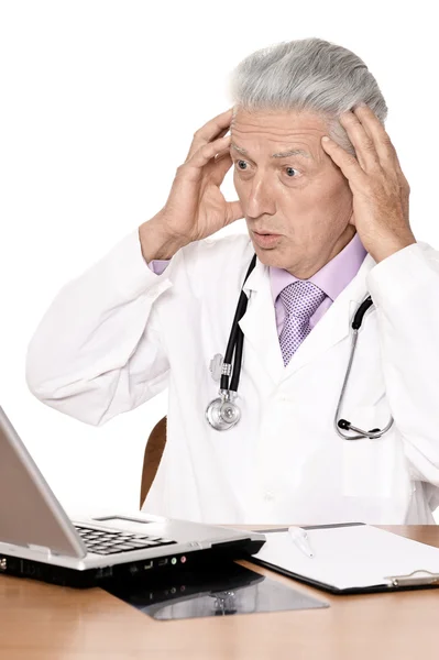 Elderly doctor with  laptop — Stock Photo, Image