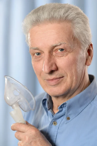 Elder man making inhalation — Stock Photo, Image