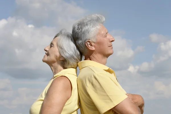 Senior couple on  sky background — Stock Photo, Image