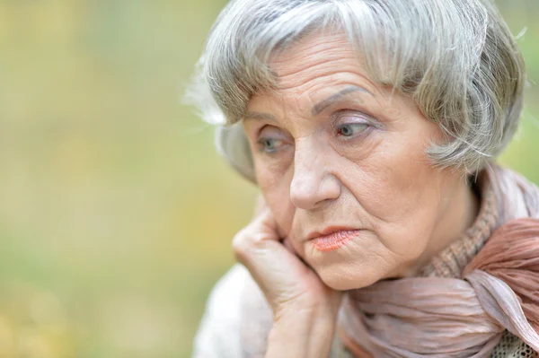 Thoughtful sad elderly woman — Stock Photo, Image