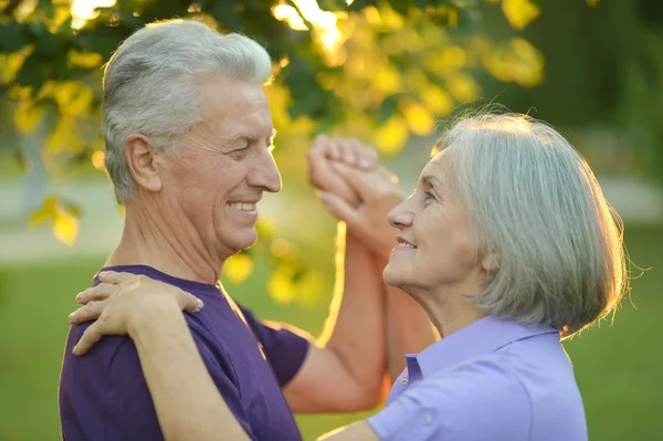 Senior couple in autumn park — Stock Photo, Image