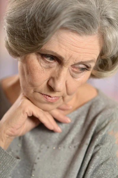 Thoughtful elderly woman — Stock Photo, Image