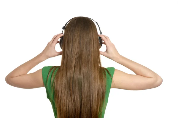 Menina ouvindo música em fones de ouvido — Fotografia de Stock