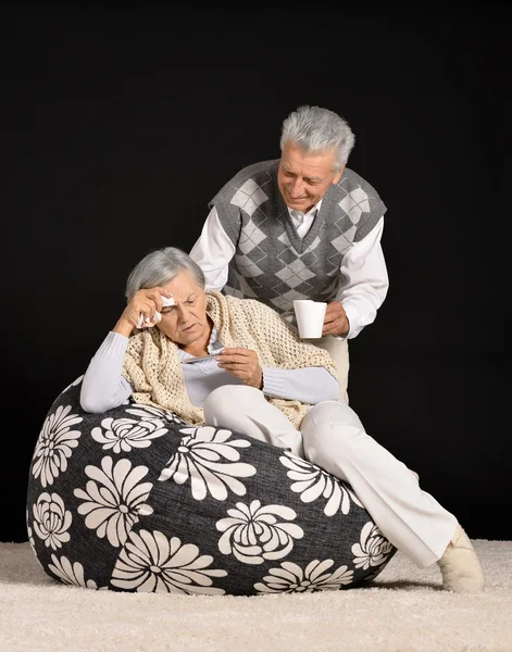 Sick elderly woman with man — Stock Photo, Image