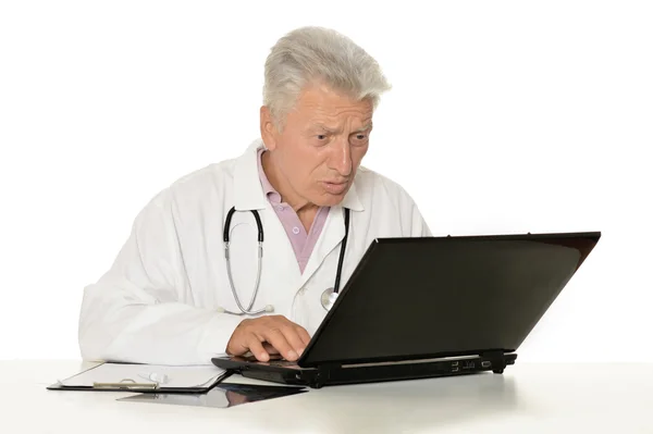 Elderly doctor with  laptop — Stock Photo, Image