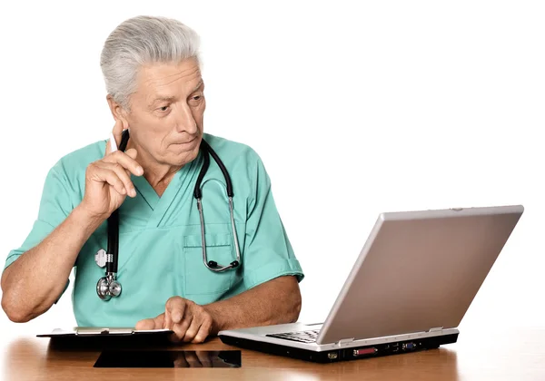 Elderly doctor with  laptop — Stock Photo, Image