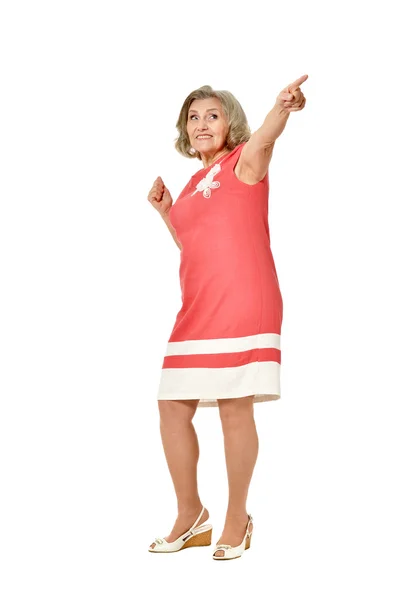 Elderly woman in dress pointing — Stock Photo, Image