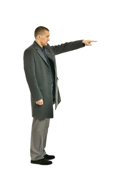 Hombre guapo con abrigo señalando —  Fotos de Stock