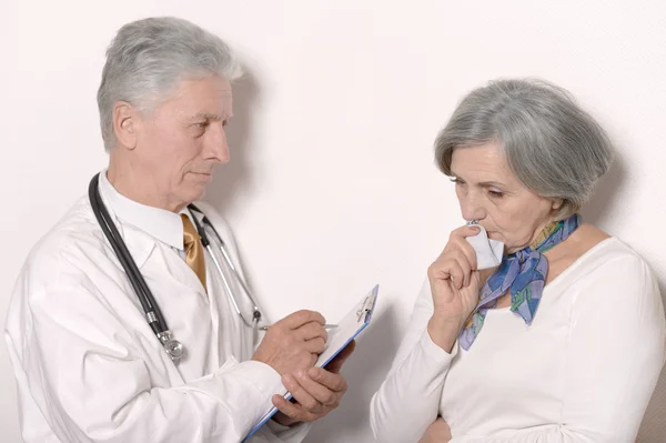 Senior woman visiting doctor — Stock Photo, Image