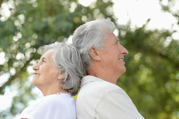 Mature couple in summer park — Stock Photo, Image