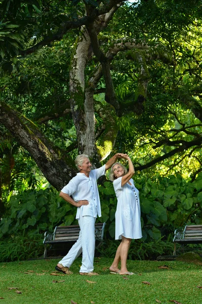 Middle-aged couple dancing outdoors — Stock Photo, Image