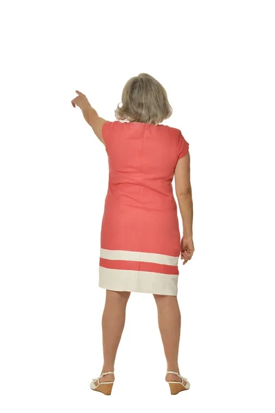 Mujer mayor en vestido señalando —  Fotos de Stock