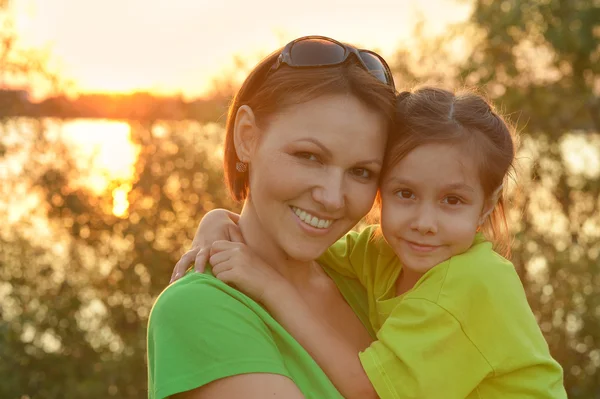 Girl with  mother in summer park — Stock Photo, Image
