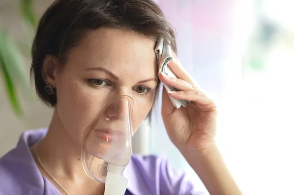 Young woman doing inhalation — Stock Photo, Image