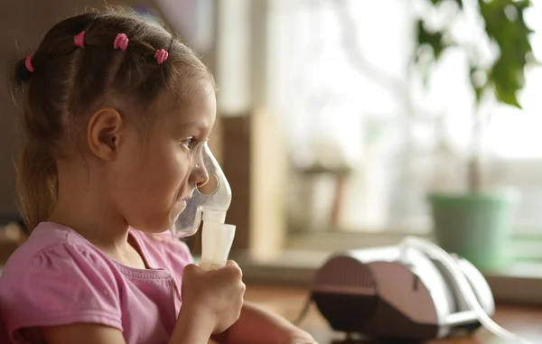 Lovely little girl with inhaler — Stock Photo, Image