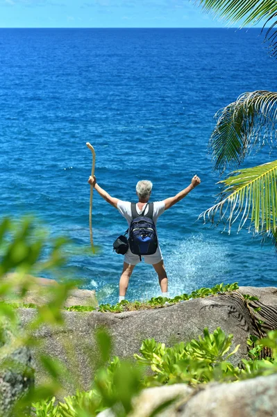 Active older man standing  on  beach — Stock Photo, Image