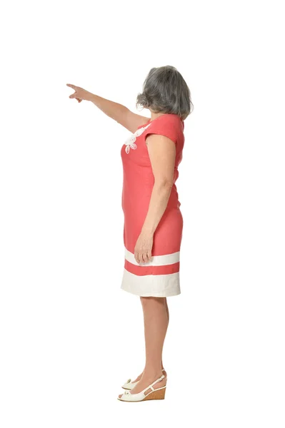 Mujer mayor en vestido señalando —  Fotos de Stock