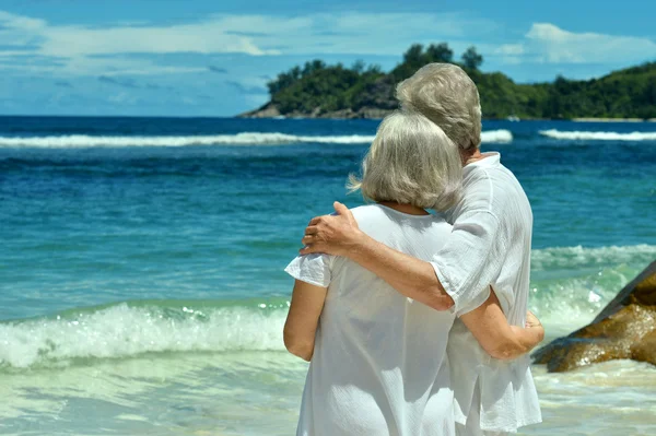 elderly couple rest at tropical resort