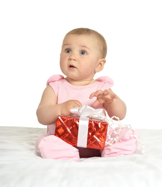 Baby girl sitting  with gift — Stock Photo, Image