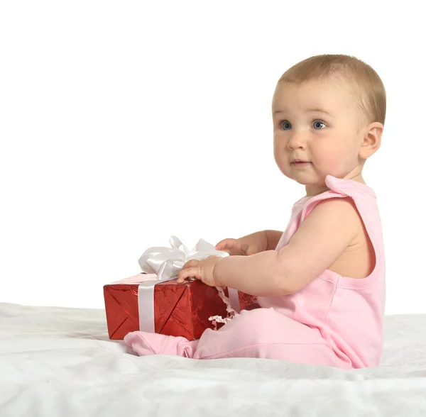 贈り物に座っている女の赤ちゃん ロイヤリティフリーのストック写真