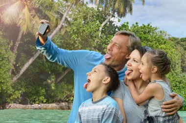 family taking selfie on  sea clipart