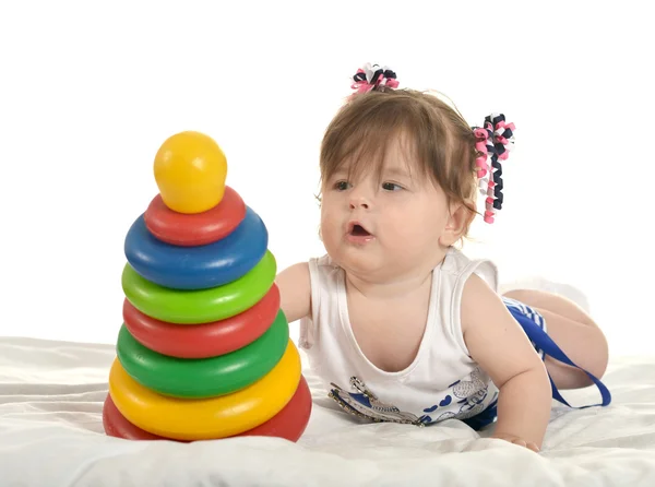 Baby girl playing with toys — Stock Photo, Image