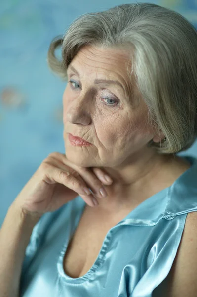 Portrait of thinking elderly woman — Stock Photo, Image