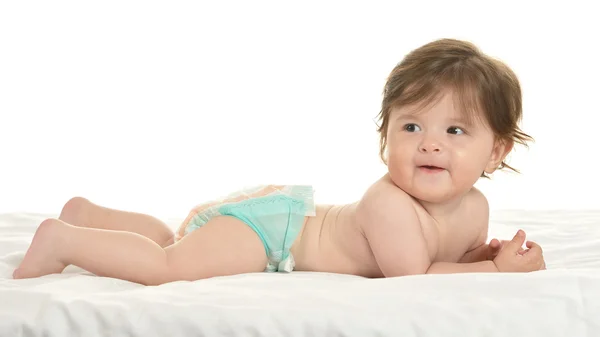 Baby girl lying in pampers — 图库照片