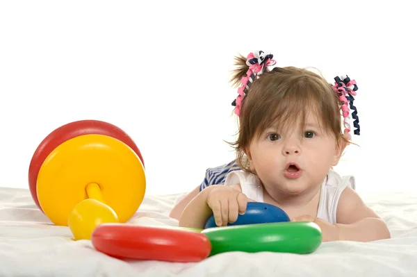 Baby girl playing with toys — Stock Photo, Image