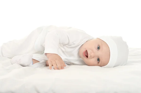 Baby girl  in hat on blanke — Stockfoto