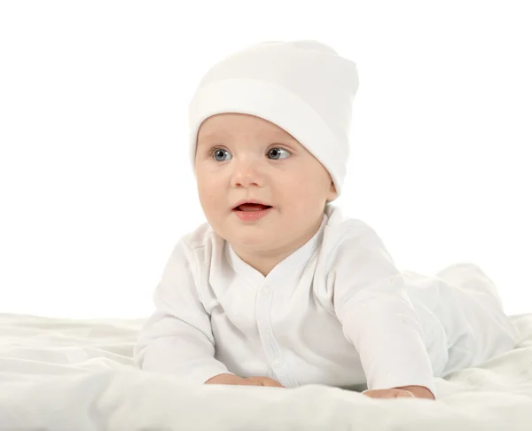 Baby girl  in hat on blanke — Stockfoto