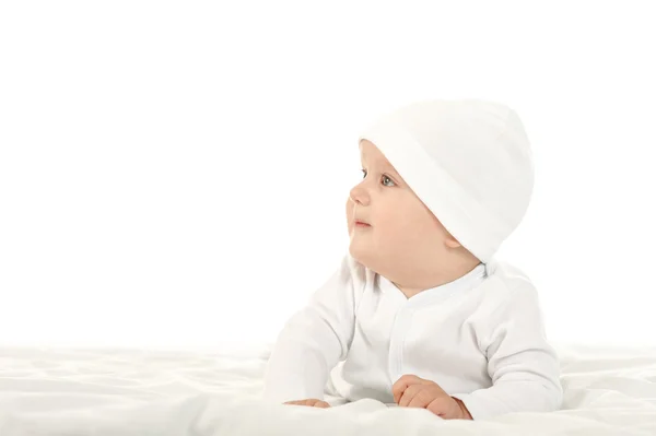 Baby girl  in hat on blanke — Stockfoto