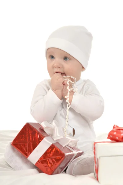 Cute baby girl   with gifts — Stockfoto