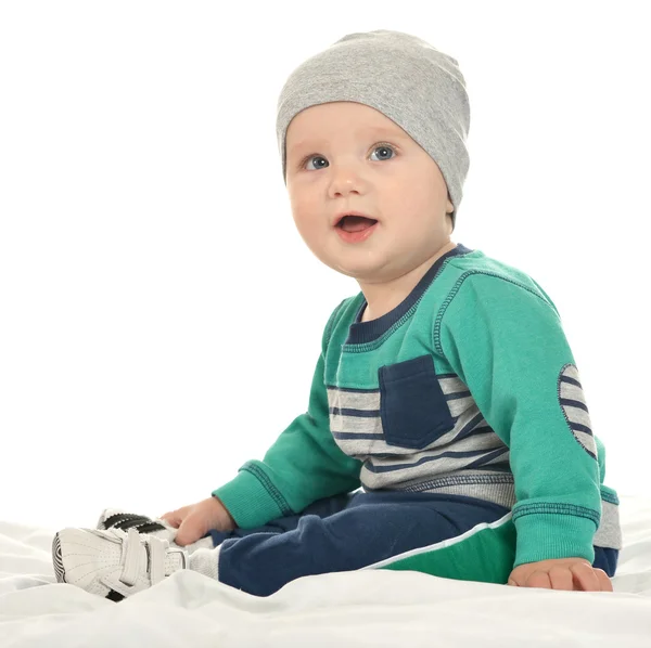 Beautiful  baby in hat  on blanket — Stock fotografie