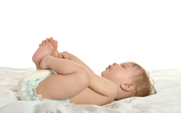 Baby girl lying in pampers — Stock Photo, Image