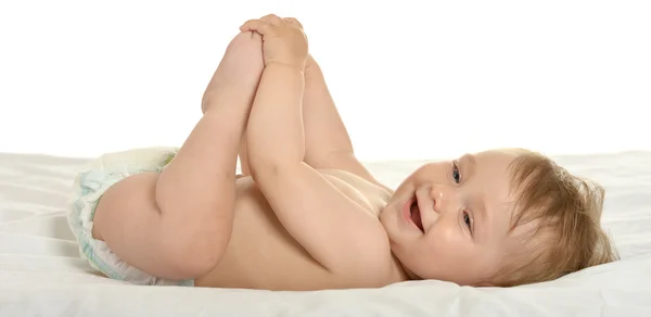 Baby girl lying in pampers — Stock fotografie