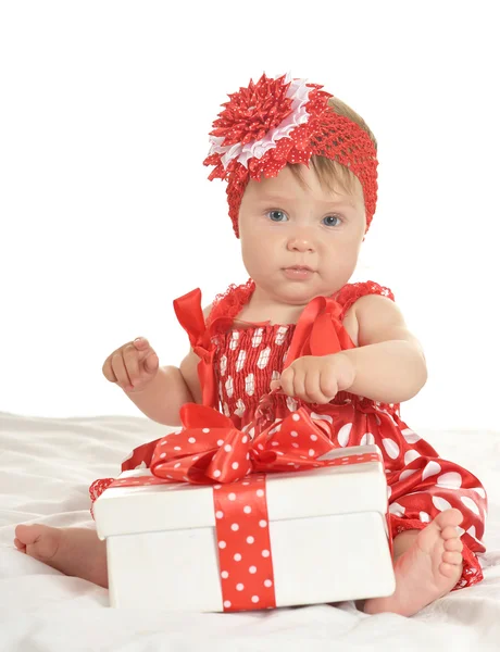 Cute baby girl with gift — Stockfoto
