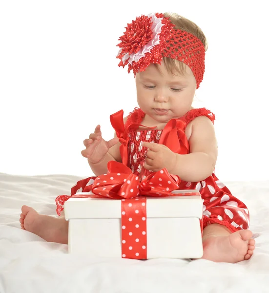 BAby girl in   dress  with gift — Stockfoto