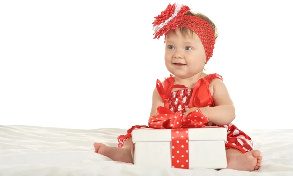 BAby girl in   dress  with gift — Stock fotografie
