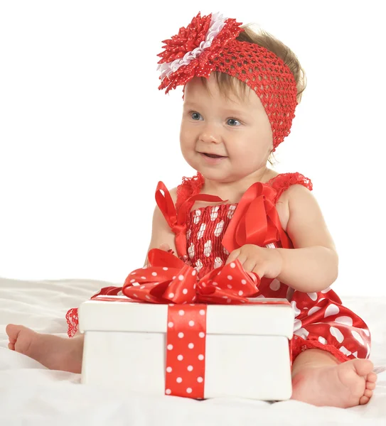 Baby girl in   dress  with gift — 스톡 사진