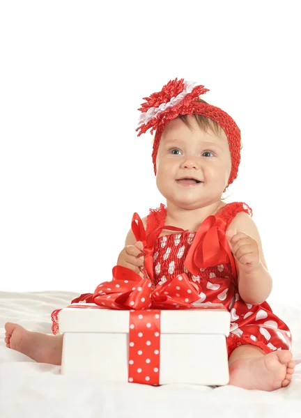 BAby girl in   dress  with gift — Stock fotografie