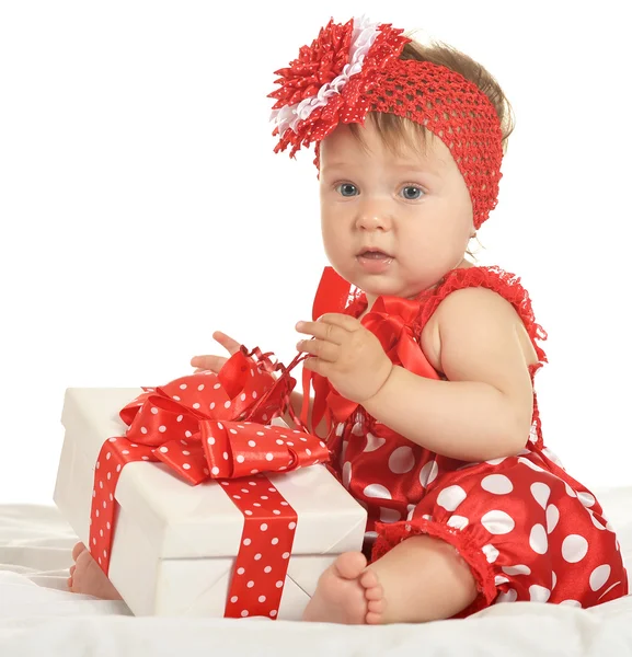 BAby girl in   dress  with gift — Zdjęcie stockowe