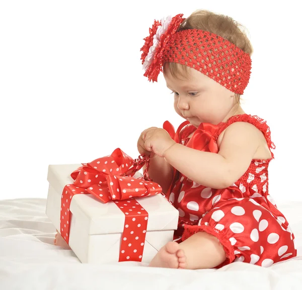 BAby girl in   dress  with gift — 图库照片